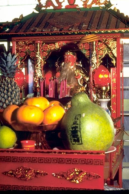 Taoist altar with food and incense offerings