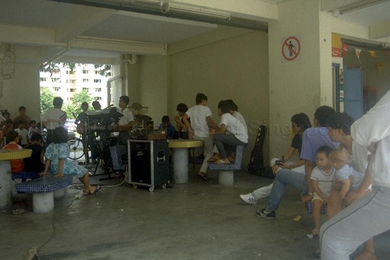 Music band in attendance during Malay wedding at void deck of Housing and Development (HDB) flat