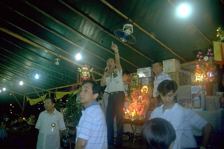 Scene from an auction of items held during Zhong Yuan Jie (mid-year festival), also known as Hungry Ghost Festival held during the seventh month of the Chinese lunar calendar