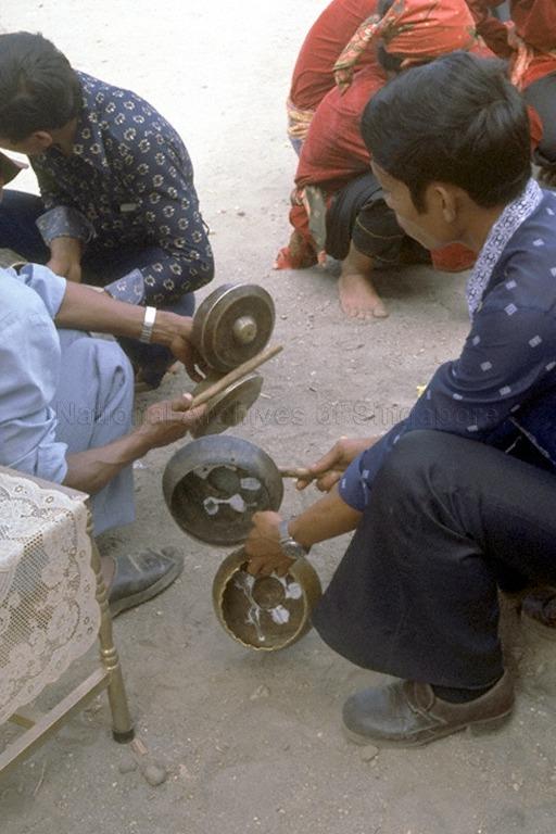 Minangkabau men with musical instruments known as talempong