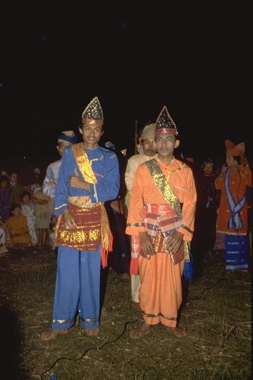 Minangkabau men in traditional clothing and headdress