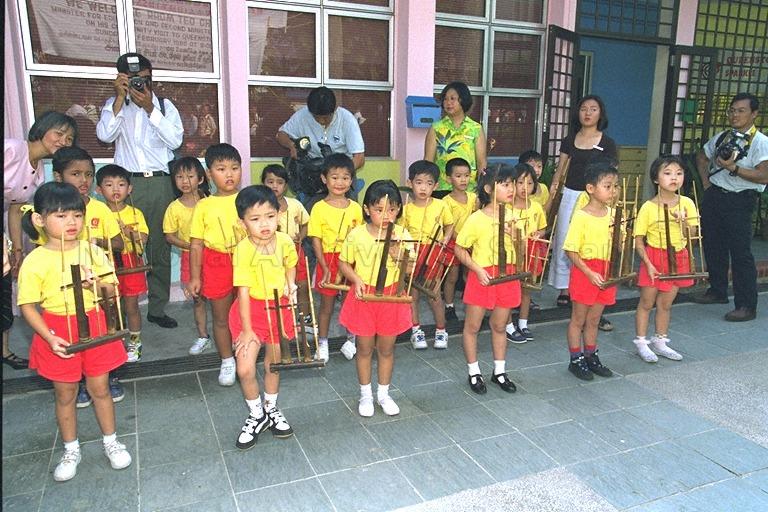 Children of Sparkletots Childcare Centre playing angklung to welcome Minister for Education and Second Minister for Defence Rear Admiral Teo Chee Hean and Members of Parliament for Tanjong Pagar Group Representation Constituency during their visit to Queenstown Division of Tanjong Pagar Group Representation Constituency at Bukit Merah
