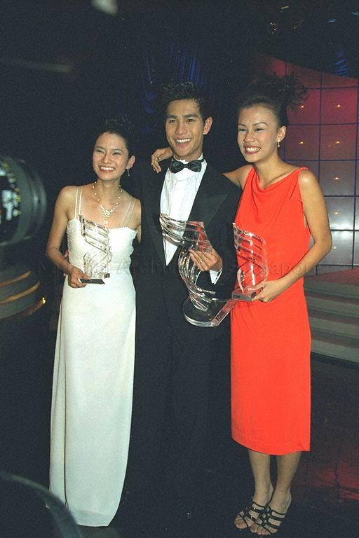 Fame Awards second prize winner Eliza Lin (left) and third prize winner Chin Li Yuen posing for a photograph with their trophies after award presentation ceremony at TCS TV Theatre