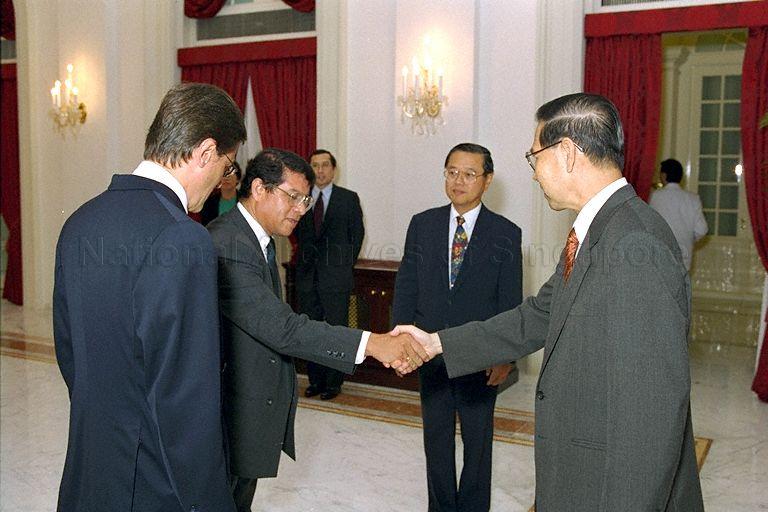 Ambassador of Mexico Eduardo Ramos Gomez (left) introducing a member of his diplomatic mission to President Ong Teng Cheong after presenting his credentials at Istana