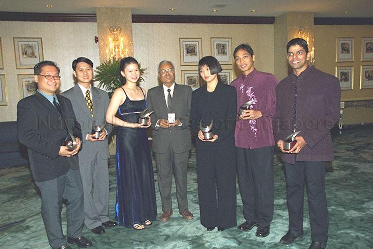 Group photograph of Cultural Medallion award recipient Rama Kannabiran (centre), Young Artist award recipients (from right) Thamizhvanan Narayanasamy Veshnu, Paul C Ocampo, Dr Joyce Koh Bee Tuan, Ms Lee Huei Min, Wu Yeow Chong and Alvin Tan Cheong Kheng at Shangri-La Hotel after National Arts Council's awards presentation ceremony. Guest of honour at the event was Minister for Information and the Arts and Second Minister for Trade and Industry Brigadier-General George Yeo Yong-Boon.