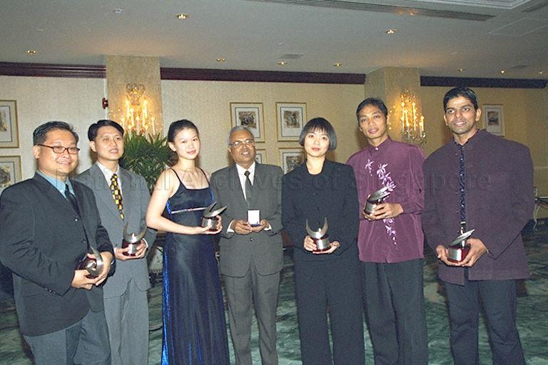 Group photograph of Cultural Medallion award recipient Rama Kannabiran (centre), Young Artist award recipients (from right) Thamizhvanan Narayanasamy Veshnu, Paul C Ocampo, Dr Joyce Koh Bee Tuan, Ms Lee Huei Min, Wu Yeow Chong and Alvin Tan Cheong Kheng at Shangri-La Hotel after National Arts Council's awards presentation ceremony. Guest of honour at the event was Minister for Information and the Arts and Second Minister for Trade and Industry Brigadier-General George Yeo Yong-Boon.