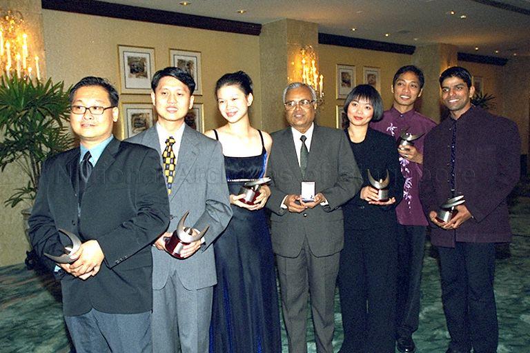 Group photograph of Cultural Medallion award recipient Rama Kannabiran (centre), Young Artist award recipients (from right) Thamizhvanan Narayanasamy Veshnu, Paul C Ocampo, Dr Joyce Koh Bee Tuan, Ms Lee Huei Min, Wu Yeow Chong and Alvin Tan Cheong Kheng at Shangri-La Hotel after National Arts Council's awards presentation ceremony. Guest of honour at the event was Minister for Information and the Arts and Second Minister for Trade and Industry Brigadier-General George Yeo Yong-Boon.