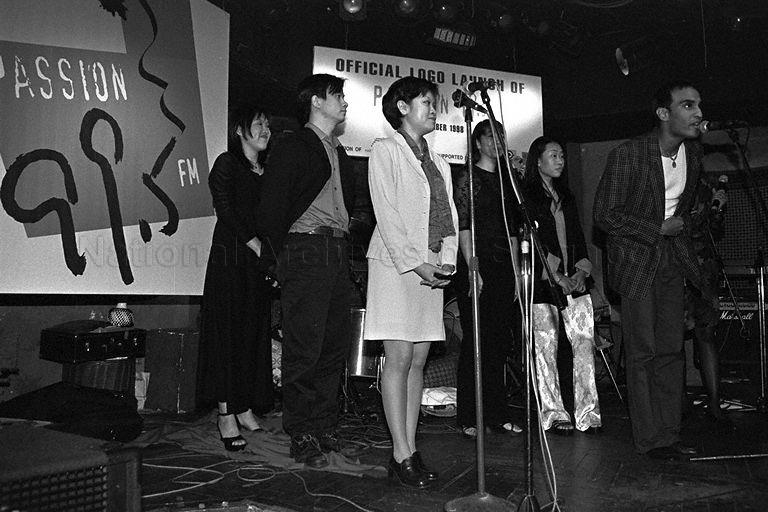 Radio producers and deejays giving a performance during official launch of Passion 99.5 FM logo at Fabrice's World Music Bar in the basement of Marriott Hotel attended by guest of honour Minister for Information and the Arts and Second Minister for Trade and Industry Brigadier-General George Yeo Yong-Boon