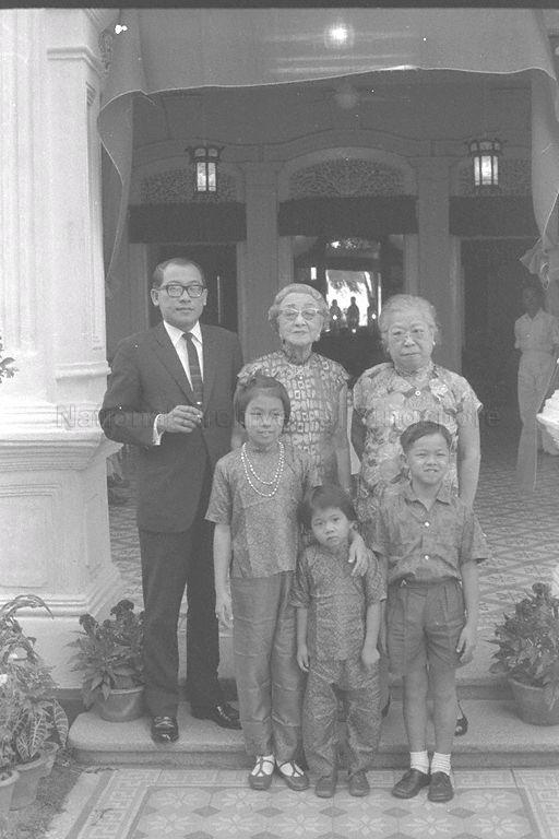 Madam Tan Teck Neo (back row, centre) posing for picture with family members during her birthday celebration at Mandalay Villa, No. 29 Amber Road. Madam Tan, born 18 December 1877, was the second wife of Straits-born Chinese businessman and philanthropist Lee Choon Guan. She became the owner of this house, the venue of many parties often attended by the rich in Singapore, when her husband passed away in 1924, and lived here with her family until her own death in February 1978. Like Mr Lee, Madam Tan was known for her charitable work which led to her being the first Chinese woman conferred a Member of the Order of the British Empire (MBE). Even her birthday was celebrated as an annual parade in her honour by Malay fishermen living free of rent in the nearby Kampong Amber owned by the Lee family.