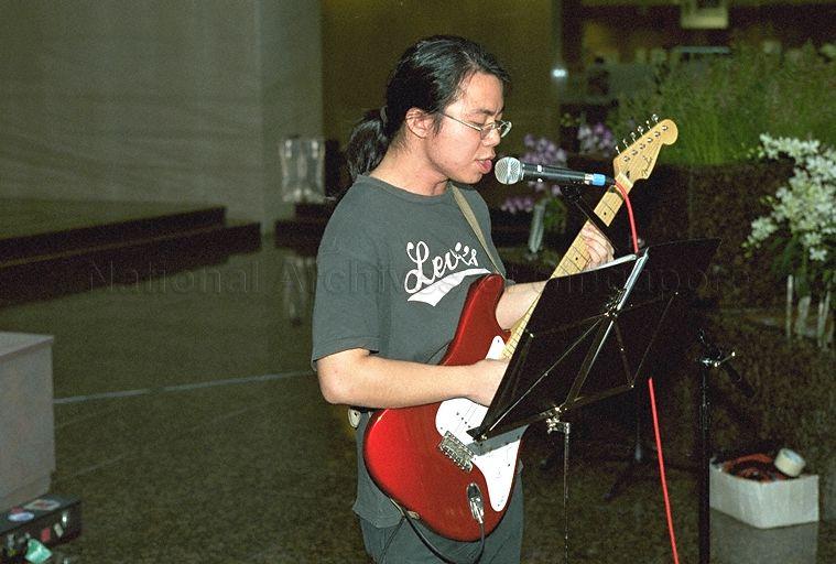 Guitarist of National University of Singapore (NUS) Jazz Band at lunchtime performance held at Port of Singapore Authority (PSA) Building atrium