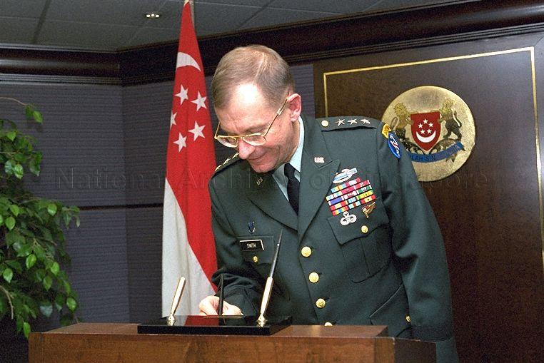 Commanding General of the United States Army, Pacific, Lieutenant General Edwin P Smith, who is on an introductory visit to Singapore, signing visitor book on arrival at Ministry of Defence, Gombak Drive, to call on Acting Minister for Defence and Minister for Education Rear Admiral Teo Chee Hean