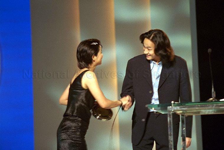 Taiwanese Singer/actor Peter Ho Yung Tung congratulating Best Actress award winner Yang Kwei-Mei during Silver Screen Awards Gala of 12th Singapore International Film Festival held in Westin Stamford