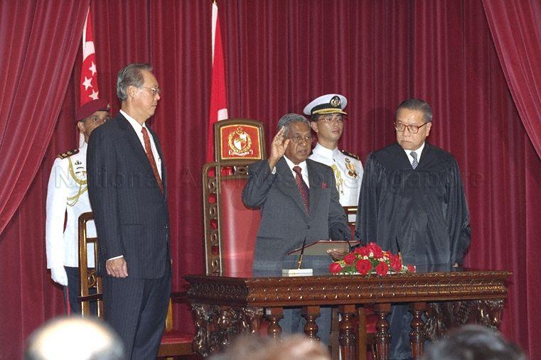 S R Nathan taking his oath of office as the sixth President of Singapore at the Istana State Room, as Prime Minister Goh Chok Tong (left) and Chief Justice Yong Pung How (right) look on