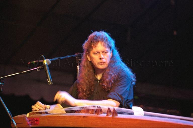 Randy Raine-Reusch playing the guzheng at the opening of World of Music, Art and Dance (Womad) '99 at Fort Canning Park; Minister for Information and the Arts and Minister for the Environment Lee Yock Suan is guest of honour at the opening