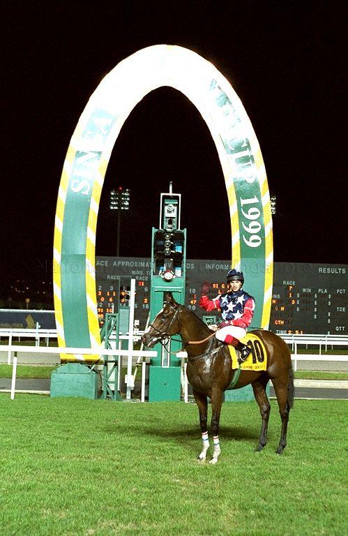 Carry the Flag, winning horse of Singapore Gold Cup 1999 at the Singapore Race Course, Singapore Turf Club, 1 Turf Club Avenue. Jockey is Brett Doyle. Prime Minister Goh Chok Tong and Mrs Goh are guests of honour at this event.