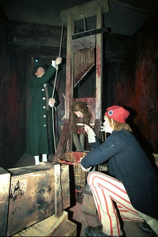 Wax figures in guillotine scene at Madame Tussaud's Singapore exhibition at World Trade Centre Hall 2, Minister for Information and the Arts and Minister for the Environment Lee Yock Suan is guest of honour at the exhibition's opening.
