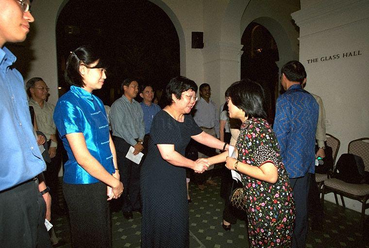 Mrs Jennifer Yeo (right), wife of Second Minister for Trade and Industry and outgoing Minister for Information and the Arts exchanging greetings with Director of Ministry of Information and the Arts Media Division Madam Yeong Yoon Ying during farewell dinner for Minister at Glass Hall, Singapore Art Museum