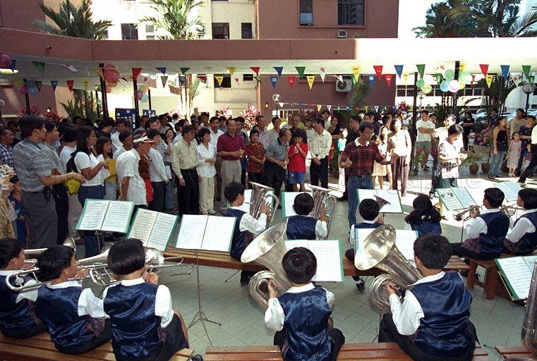 School band performance at Pacific Mansion in River Valley Close during Minister for Trade and Industry Brigadier-General George Yeo Yong-Boon's community visit to Kim Seng ward of Kreta Ayer-Tanglin Group Representation Constituency