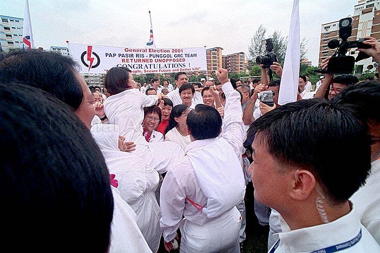 Penny Low, a People's Action Party (PAP) candidate for Pasir Ris-Punggol Group Representation Constituency being held up by supporters at White Sands Primary School (Nomination Centre for Hougang Constituency and Pasir Ris-Punggol Group Representation Constituency) on General Elections 2001 Nomination Day. The PAP won the seat unopposed.
