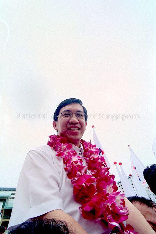 Michael Lim, a People's Action Party (PAP) candidate for Pasir Ris-Punggol Group Representation Constituency being held up by supporters at White Sands Primary School (Nomination Centre for Hougang Constituency and Pasir Ris-Punggol Group Representation Constituency) on General Elections 2001 Nomination Day. The PAP won the seat unopposed.