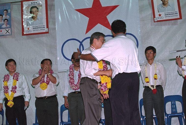 Taken at: Singapore Democratic Alliance (SDA) rally for the 2001 General Election at the open field between Kallang Avenue and Lavender Street opposite Block 19 Kallang Avenue Industrial Estate Pictured: SDA candidate for Potong Pasir Single Member Constituency (SMC) Chiam See Tong, and SDA candidates for Jalan Besar GRC Lim Bak Chuan and Sin Kek Tong