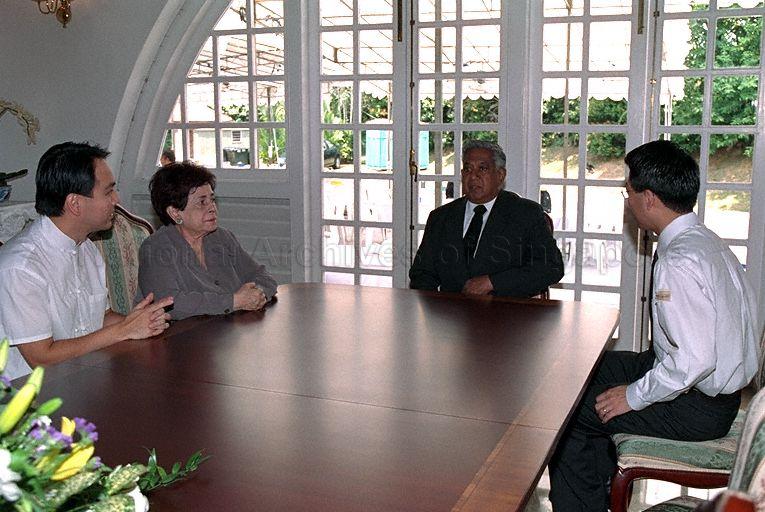 President S R Nathan (centre) and his wife Mrs Nathan spending time with Ong Tze Guan (right) and Tze Boon during the late former President Ong Teng Cheong's wake at 1 Dalvey Estate
