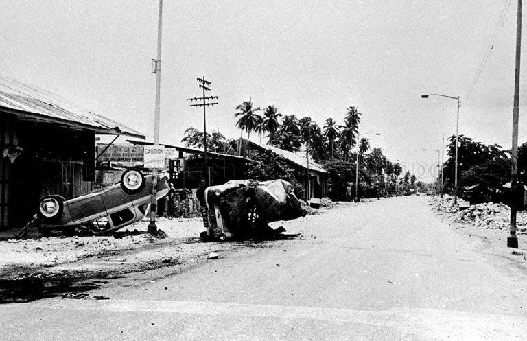 Wrecked vehicles during the 1964 racial riots