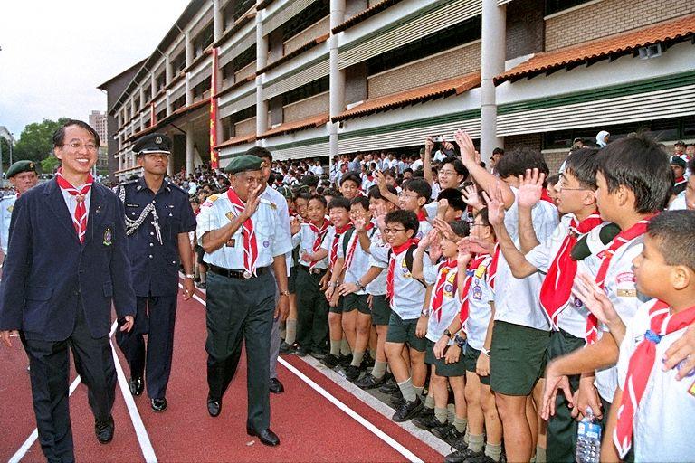 President S R Nathan waving to student scouts when he attended the World Scout Rally 2000 at Catholic High School. He was also installed as the Chief Scout during the event.