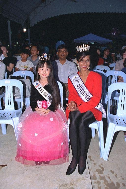 The reigning Little Miss Singapore Elizabeth Quek and Mrs Singapore International Sharmini Anandam attending launch of Sing Singapore 2000 at Music Street at Orchard Mass Rapid Transit (MRT) station park. Sing Singapore is held every two years to discover and promote original songs written by Singaporeans for Singaporeans. The five-month-long campaign includes singing competitions, free public concerts and music video launches. Minister of State for Defence and Minister of State for Information and the Arts David T E Lim is guest of honour at the launch.