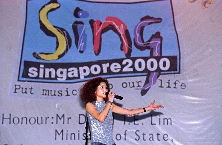 An artiste performing at launch of Sing Singapore 2000 at Music Street at Orchard Mass Rapid Transit (MRT) station park. Sing Singapore is held every two years to discover and promote original songs written by Singaporeans for Singaporeans. The five-month-long campaign includes singing competitions, free public concerts and music video launches. Minister of State for Defence and Minister of State for Information and the Arts David T E Lim is guest of honour at the launch.