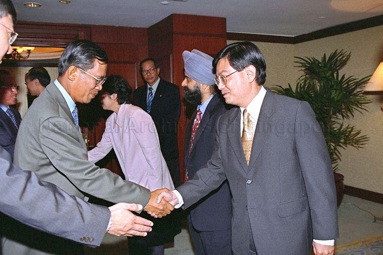 Prime Minister of Cambodia Hun Sen (left) being greeted by Deputy Secretary (Trade) to Ministry of Trade and Industry (MTI) Heng Swee Keat on arrival at Azalea Room, Shangri-La Hotel, for luncheon hosted by Minister for Trade and Industry Brigadier-General George Yeo Yong-Boon
