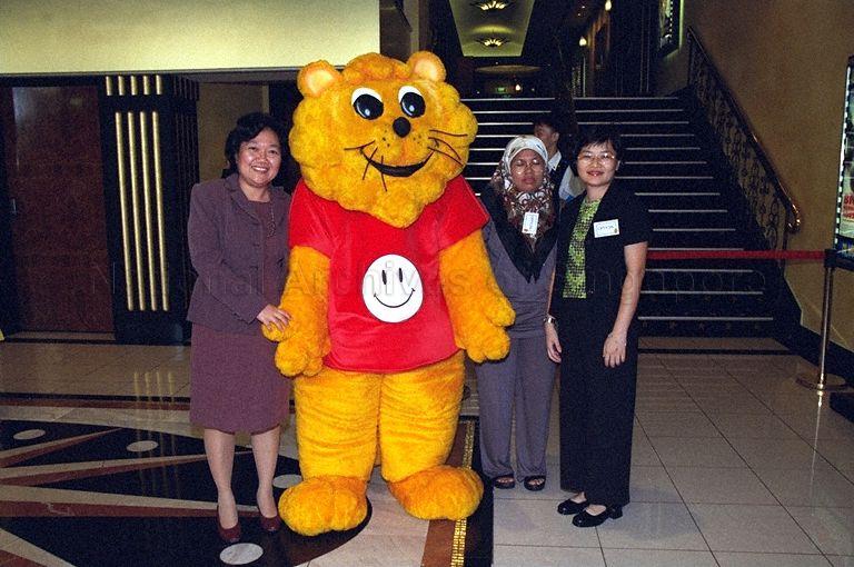 Officials posing for photograph with Singa the Courtesy Lion, mascot for Courtesy Campaign, during launch of 22nd National Courtesy Campaign at Golden Village Grand cinema complex, Great World City