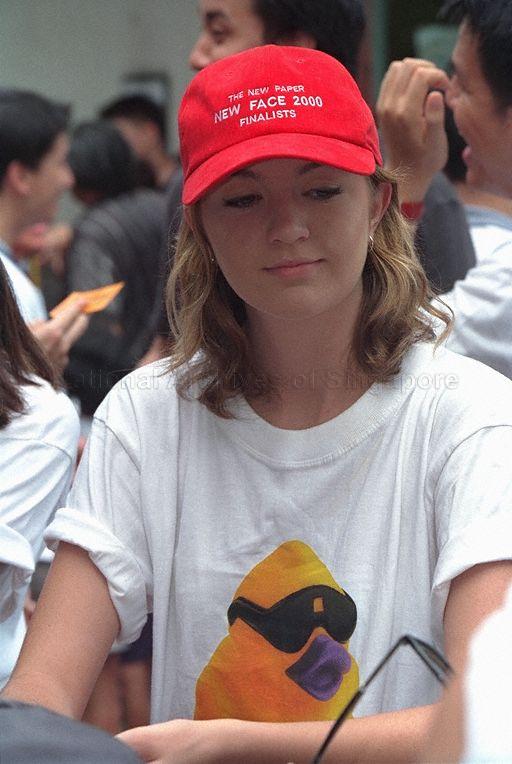 A finalist of The New Paper's New Face 2000 competition at Straits Times Million Dollar Duck Race at the Singapore River. President S R Nathan is guest-of-honour at the race, in which about 100,000 rubber ducks participate and which sets a world record for the number of ducks adopted for a charity race. Proceeds from the race go to Touch Community Services and physical education teacher Abdul Razak wins first prize of $10,000.