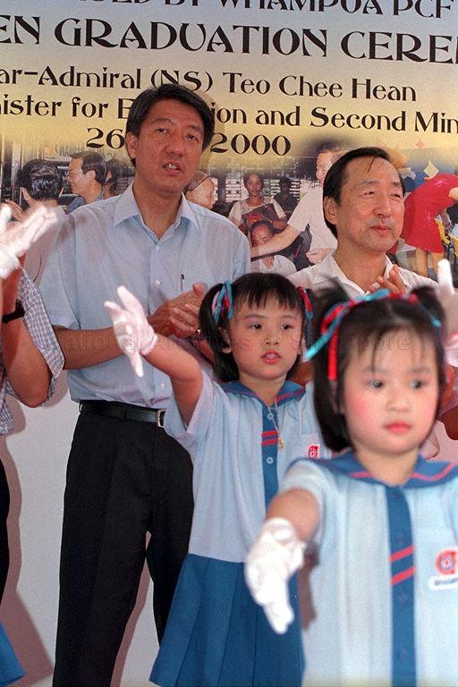 Minister for Education and Second Minister for Defence Rear Admiral Teo Chee Hean (left) and Member of Parliament for Bukit Timah Group Representation Constituency Dr Wang Kai Yuen (right) joining the children singing at Graduation Ceremony 2000 for Whampoa Division kindergarten