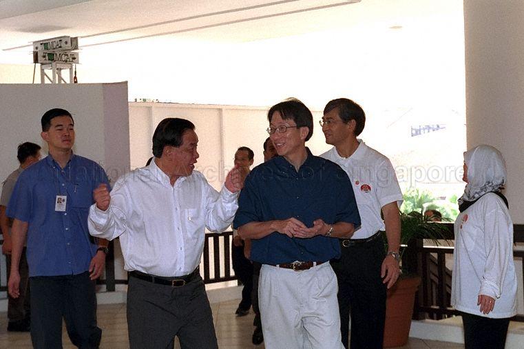 Member of Parliament for Nee Soon Central Ong Ah Heng and Minister for the Environment Lim Swee Say arriving for National Trades Union Congress (NTUC) May Day Rally 2002 at NTUC Downtown East