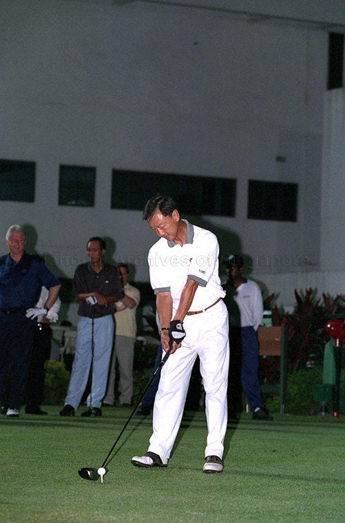Golfer teeing off at Jurong Country Club during golf game hosted by Prime Minister Goh Chok Tong for former United States President Bill Clinton