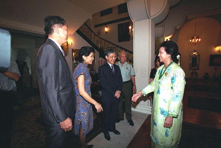 Sultanah Zanariah binti Almarhum Tengku Ahmad welcoming her guests Minister, Prime Minister's Office and Second Minister for Foreign Affairs Lee Yock Suan, Minister for Education and Second Minister for Defence Rear Admiral Teo Chee Hean and Mrs Teo to Istana Bukit Serene, Johore Bahru during Hari Raya celebration as Sultan of Johore Sultan Iskandar Ibni Almarhum Sultan Ismail looks on