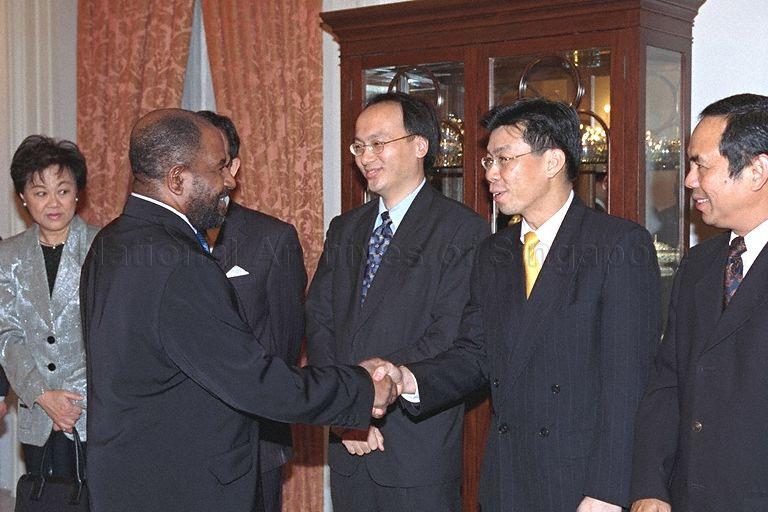 President of Union of Comoros Azali Assoumani (shaking hands, left) meeting Members of Parliament and Singapore officials at dinner at Istana hosted by Prime Minister Goh Chok Tong
