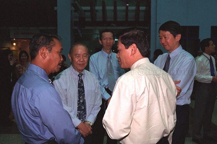 Vice Minister of Culture and Information of Vietnam Tran Chien Thang (front, right, back to camera) in conversation with Senior Parliamentary Secretary to Ministry of Information, Communications and the Arts (MICA) Yatiman Yusof (front, left), Principal of Nanyang Academy of Fine Arts Ho Kah Leong and Permanent Secretary to MiICA Dr Tan Chin Nam (right) during opening of "Viewing Vietnam", an Exhibition of Fine Arts from Vietnam to commemorate 30 years of Singapore-Vietnam diplomatic relations, held at Atrium, Ministry of Information and the Arts Building