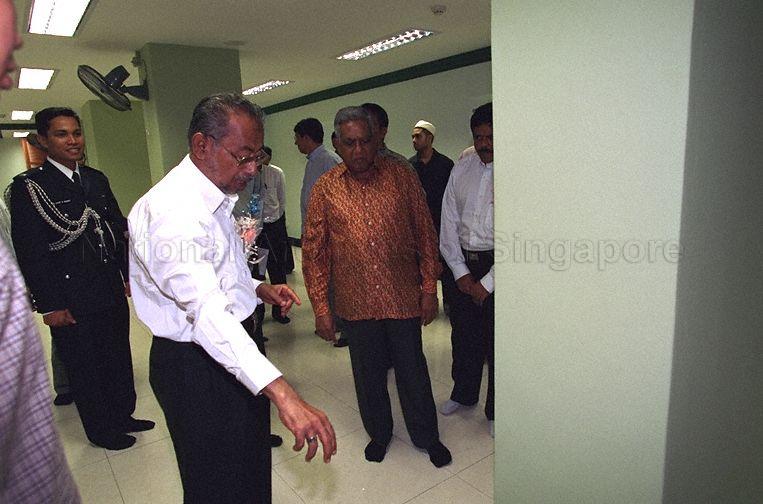 Chairman of Abdul Gafoor Mosque A G Mohamed Mustapha showing President S R Nathan around the basement prayer hall that was added in the process of restoring the mosque.