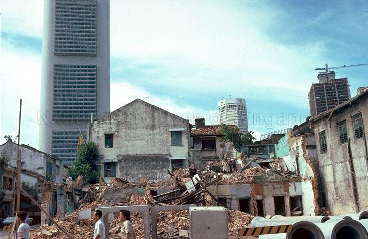 View of demolished shophouses in Chinatown. Buildings in the background include Overseas Chinese Banking Corporation (OCBC) Centre on the left and United Overseas Bank (UOB) building (now known as UOB Plaza Two) in the middle.