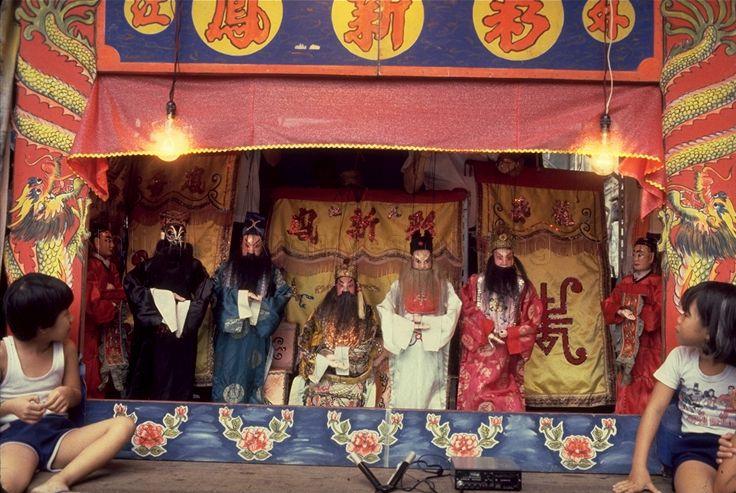 Children seated close to stage during string puppet (marionette) show