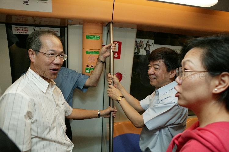 Minister for Transport Yeo Cheow Tong (left), Mrs Helen Yeo and Senior Minister of State for Transport and Information, Communications and the Arts Khaw Boon Wan (centre) on board the train travelling between Sengkang and Potong Pasir Mass Rapid Transit (MRT) stations of the newly-opened North East Line (NEL)