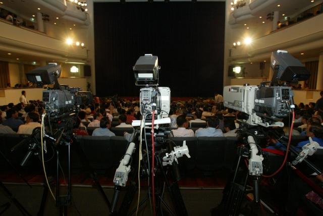 Cameras being put in position to cover National Day Rally at University Cultural Centre, Kent Ridge