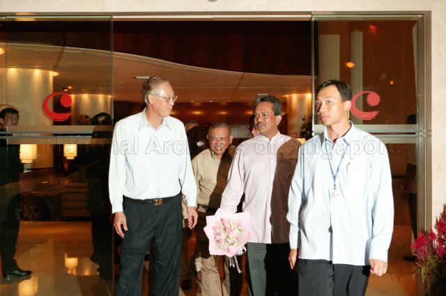 Guest-of-Honour Prime Minister Goh Chok Tong accompanied by Mayor of South East Community Development Council (CDC) Othman bin Haron Eusofe (partially hidden) and Member of Parliament for Marine Parade Group Representation Constituency (GRC) Mohamad Maidin bin Packer Mohd (second from right) exiting Century Roxy Park Hotel after Marine Parade Town Councillors' appreciation dinner