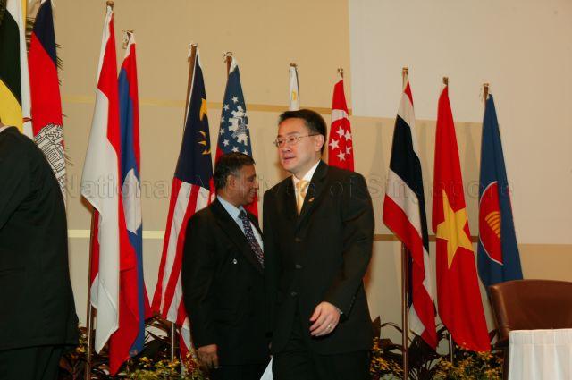 Thailand's Vice Minister of Finance Dr Virachai Virameteekul and Malaysia's Second Minister for Finance Nor Mohamed Yakcop taking leave after 8th Association of Southeast Asian Nations (ASEAN) Finance Ministers' Meeting (AFMM) session at Shangri-la Hotel