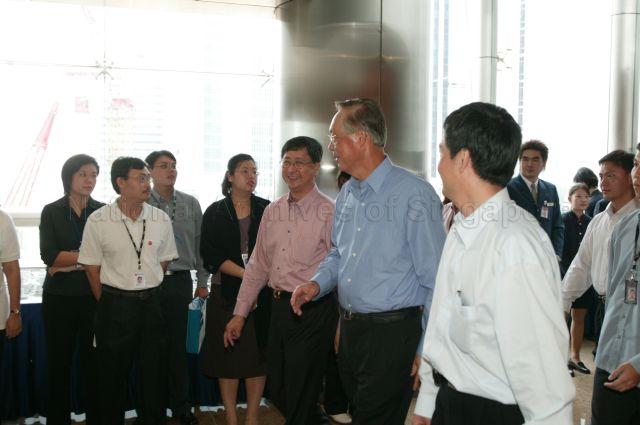Guest-of-Honour Prime Minister Goh Chok Tong accompanied by Minister in Prime Minister's Office and Secretary-General of National Trades Union Congress (NTUC) Lim Boon Heng and NTUC Deputy Secretary-General Heng Chee How (right) leaving NTUC Centre after May Day Rally and official opening of the building at One Marina Boulevard