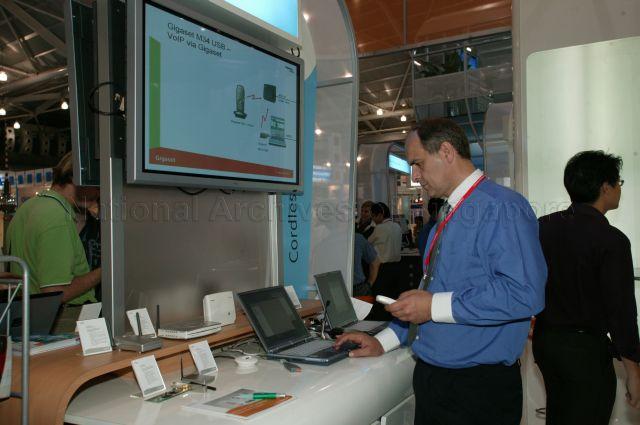 Official at exhibition booth during Infocomm Media Business Exchange at Singapore Expo Conference Hall