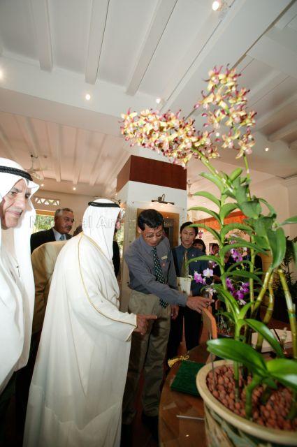 Director of Singapore Botanic Gardens Dr Chin See Chung briefing Kuwaiti Prime Minister Sheikh Sabah Al-Ahmad Al-Jaber Al-Sabah, who is in Singapore for a two-day official visit, on new orchid hybrid to be named after him during visit to National Orchid Garden located within SIngapore Botanic Gardens