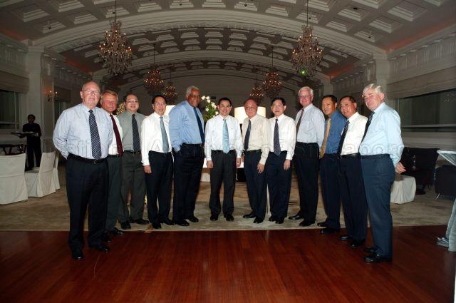 Group photograph of Neptune Orient Lines (NOL) staff and Board of Directors taken during launch of book "Beyond boundaries: The first 35 years of the NOL story" and "NOL Beyond Boundaries Trust Fund" at Fullerton Hotel. From left, Chief Executive Officer of APL Ron Widdows and members of Board of Directors, Friedbert Malt, Lim How Teck, Christopher Lau, Robert Holland, David Lim, Ang Kong Hua, Gan Chee Yen, Tim Rhein, Willie Cheng, Loke Sai Hung and Connal Rankin.
